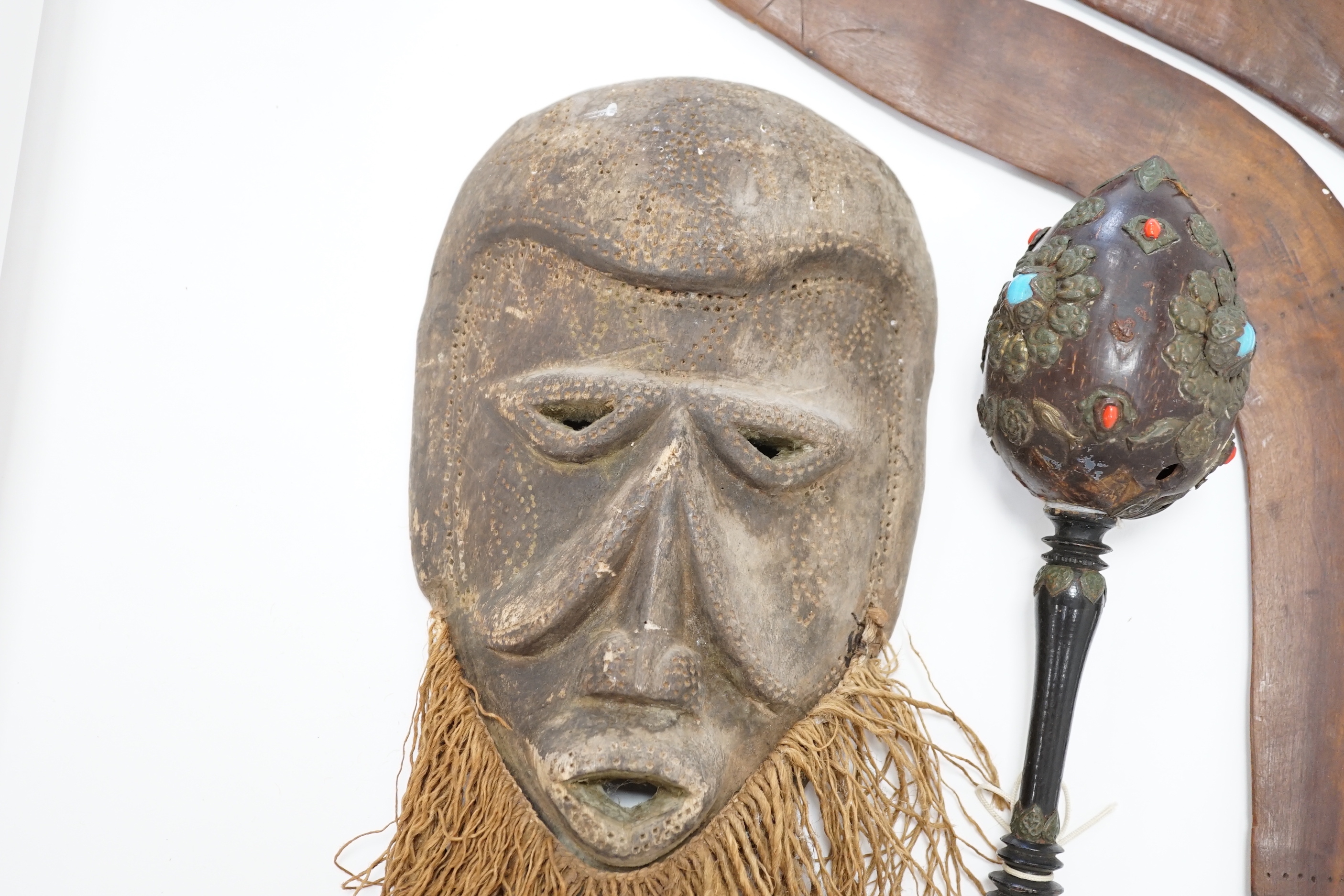Two Aboriginal boomerangs, an African mask, a painted lion figure and four other items (8)